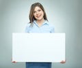 Smiling business woman holding big white banner. Royalty Free Stock Photo