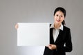 Smiling business woman holding blank board Royalty Free Stock Photo