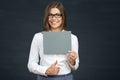 Smiling business woman holding blank board Royalty Free Stock Photo