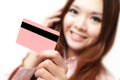 Smiling business woman holding a credit card Royalty Free Stock Photo