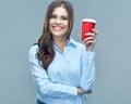 Smiling business woman holding red coffee glass.