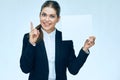 Smiling business woman holding white blank sign board. Royalty Free Stock Photo