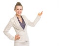 Smiling business woman pointing on copy space Royalty Free Stock Photo