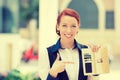 Smiling business woman pointing at many credit cards in her wallet Royalty Free Stock Photo