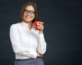 Smiling business woman with red coffee cup. Royalty Free Stock Photo