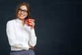 Smiling business woman with red coffee cup. Royalty Free Stock Photo