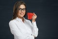 Smiling business woman with red coffee cup. Royalty Free Stock Photo