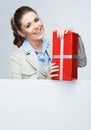 Smiling business woman red gift box hold. Royalty Free Stock Photo