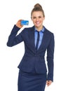 Smiling business woman showing credit card Royalty Free Stock Photo