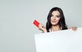Smiling business woman showing red empty card Royalty Free Stock Photo
