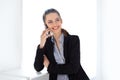 Smiling business woman speaking on mobile phone Royalty Free Stock Photo