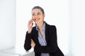 Smiling business woman speaking on mobile phone Royalty Free Stock Photo