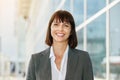 Smiling business woman standing in the city Royalty Free Stock Photo