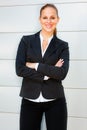 Smiling business woman standing at office building Royalty Free Stock Photo