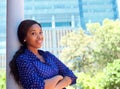 Smiling business woman standing outside office building Royalty Free Stock Photo