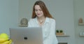 Smiling business woman talking mobile phone at home office. Portrait of joyful girl making phone call at remote Royalty Free Stock Photo