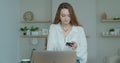 Smiling business woman talking mobile phone at home office. Portrait of joyful girl making phone call at remote Royalty Free Stock Photo