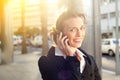 Smiling business woman talking on mobile phone Royalty Free Stock Photo