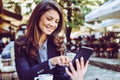 Smiling business woman using technology.