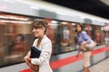 Smiling business  woman waiting for metro in subway.traveling at work Royalty Free Stock Photo