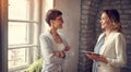 Smiling business women exchanging ideas