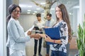 Smiling business women shaking hands. Royalty Free Stock Photo