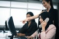 Smiling business women team working at office desk and discussing a project on computer Royalty Free Stock Photo