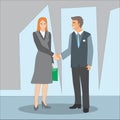 Smiling businessman and businesswoman shaking hands on a deal. Royalty Free Stock Photo