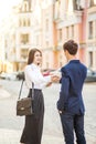 Smiling businessman and businesswomen handshake for a business meeting outdoor.