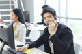 Smiling Businessman Call Center and technical Support staff with headset talking and Typing keyboard for job. Asian customer Royalty Free Stock Photo