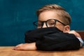 Smiling businessman child sitting at the table Royalty Free Stock Photo