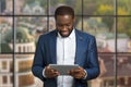 Smiling businessman with computer tablet. Royalty Free Stock Photo