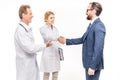 smiling businessman and doctors greeting each other Royalty Free Stock Photo