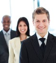 Smiling businessman in front of his team Royalty Free Stock Photo