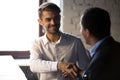 Smiling businessman, hr manager shaking hand of African American intern Royalty Free Stock Photo