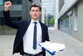 Smiling businessman is happy after successful signing contract Royalty Free Stock Photo