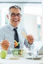 Smiling businessman having a lunch break Royalty Free Stock Photo