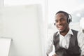 Smiling businessman with headset interacting Royalty Free Stock Photo