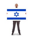 Smiling businessman holding a big card, flag of Israel Royalty Free Stock Photo