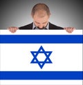 Smiling businessman holding a big card, flag of Israel Royalty Free Stock Photo