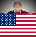 Smiling businessman holding a big card, flag of the United State Royalty Free Stock Photo