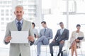 Smiling businessman holding a blank sign Royalty Free Stock Photo