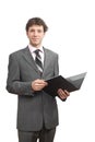 Smiling businessman holding document folder