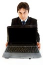 Smiling businessman holding laptops blank screen Royalty Free Stock Photo