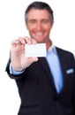 Smiling businessman holding a white card Royalty Free Stock Photo