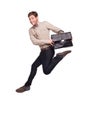 Smiling businessman jumping with briefcase Royalty Free Stock Photo