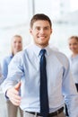 Smiling businessman making handshake in office Royalty Free Stock Photo