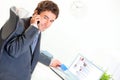 Smiling businessman making purchase by phone Royalty Free Stock Photo