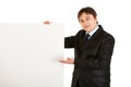 Smiling businessman pointing at blank billboard Royalty Free Stock Photo