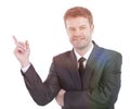 Smiling businessman pointing copy space. Royalty Free Stock Photo